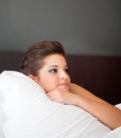 Girl reclining on bed